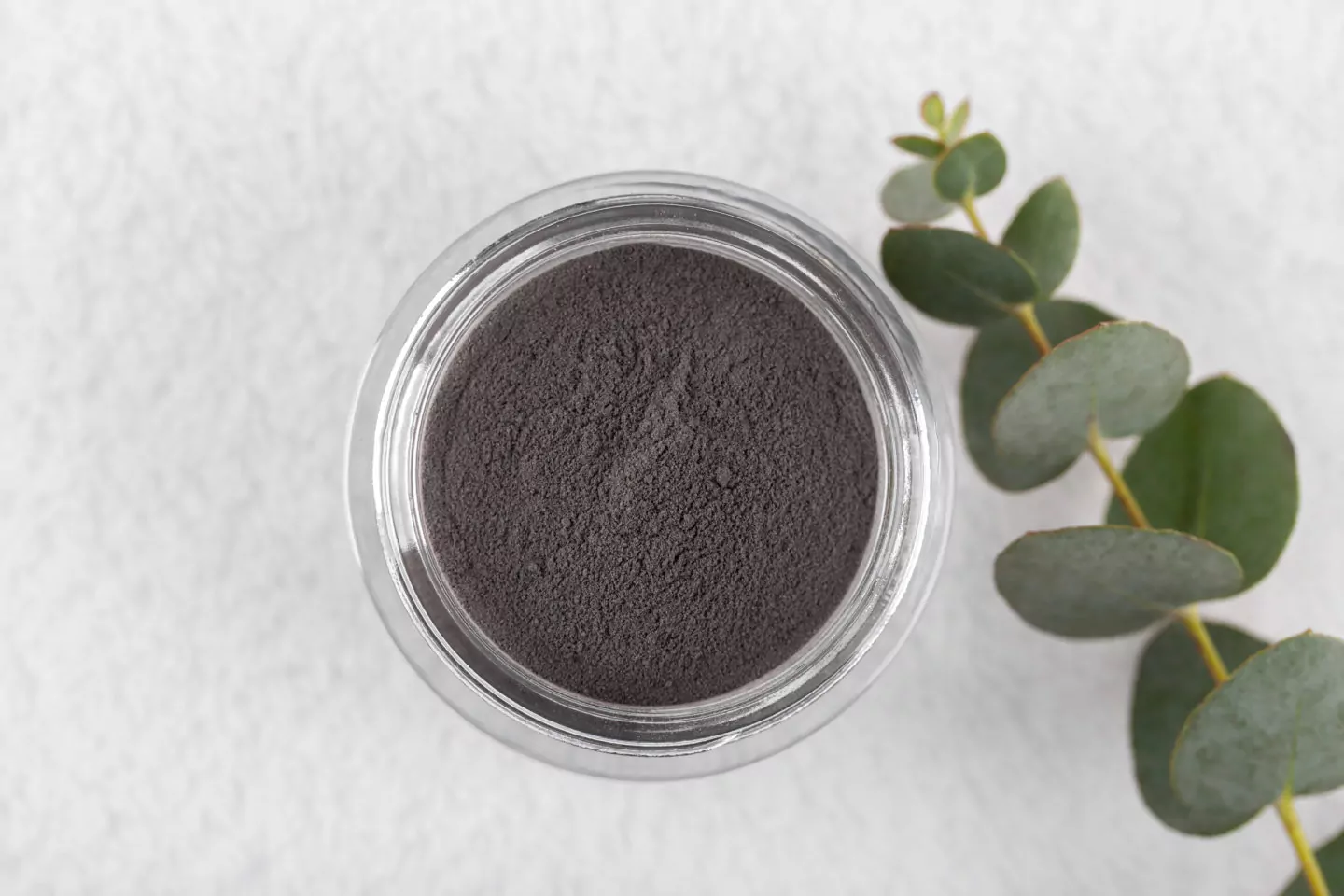 Black cosmetic clay powder for skin and hair